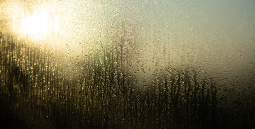 glass-window-reflecting-light-through-its-wet-texture.jpg
